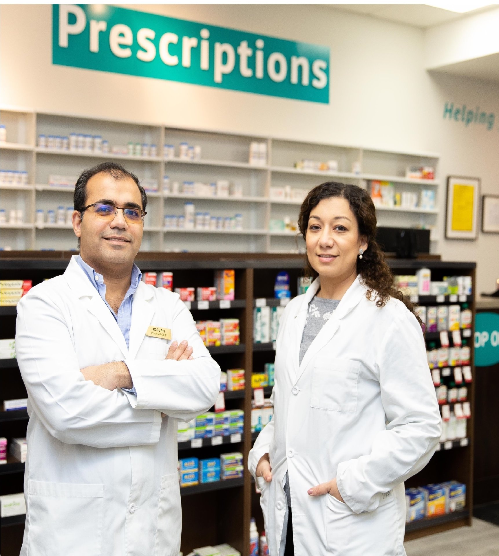 Pharmacists at Royal Simcoe Pharmacy standing behind the prescriptions counter